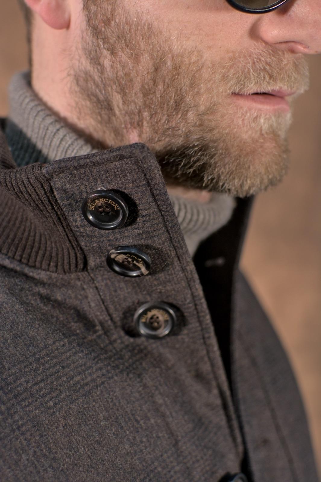 Engraved Bilancioni horn button on a brushed wool stand collar