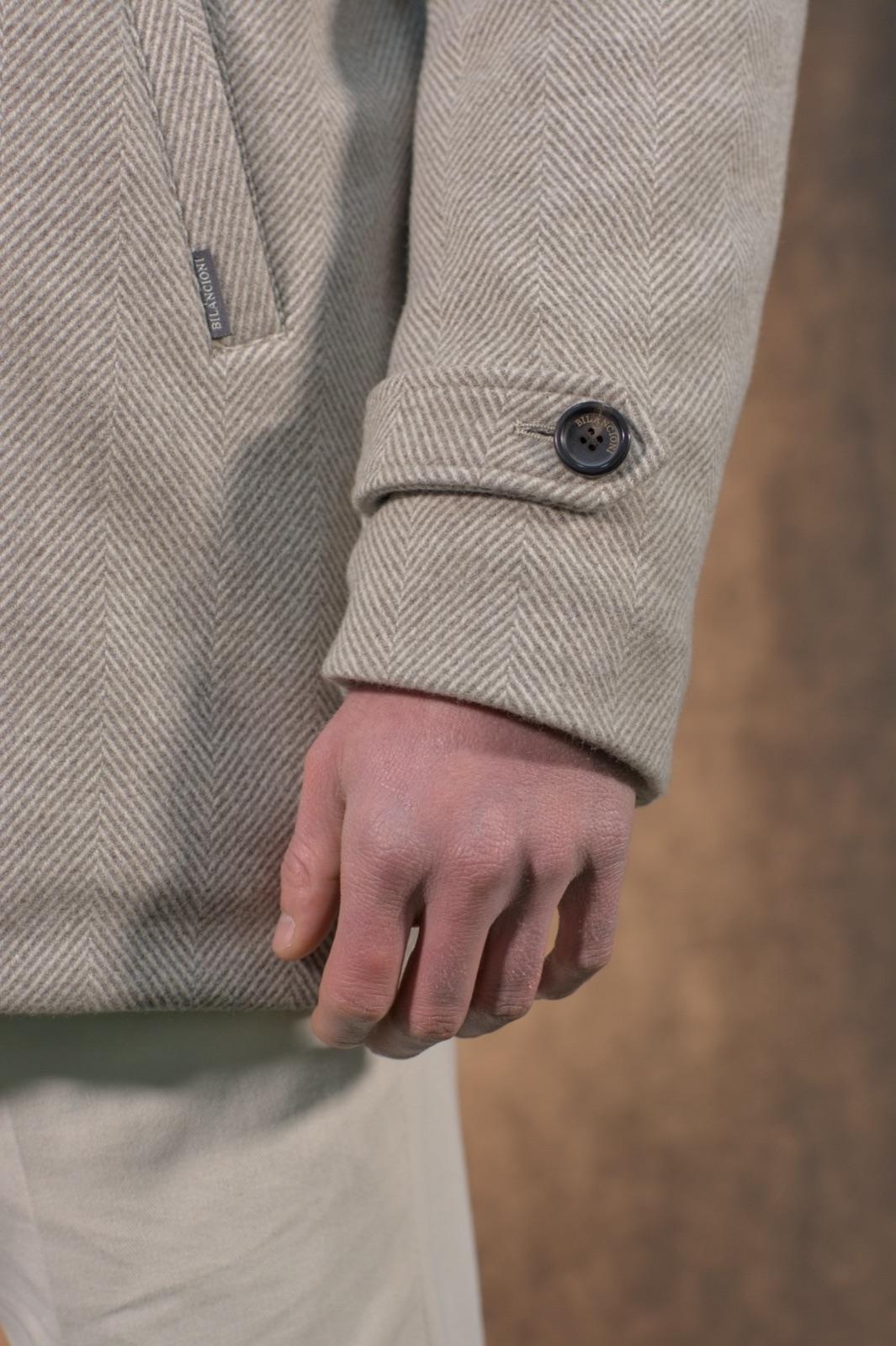 Herringbone woven cuff with an engraved Bilancioni button